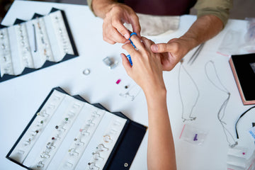 Expert jeweler resizing a gold ring